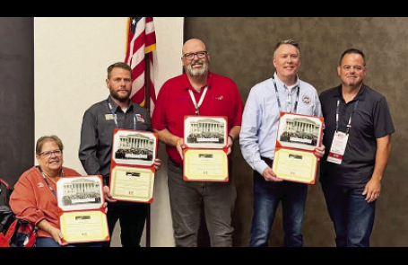 DeSoto Dy. Chief Phillip Daniels (standing on right end) with honorees.
