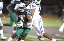 Wolverines Fall to Raiders in Tough Friday Night Battle