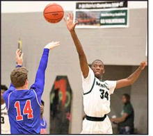 Sophomore Trenton Colbert blocking a shot Thursday night by Mickey Morgan