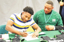 MHS’s Justin Davis and Adrian Green Sign to Play Collegiate Level Football
