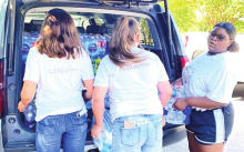 Logansport Jr. High Cheer & Pep Squad Disburse Water for Community Project