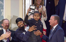 DJ Daniel is pictured being hoisted up by his father Theodis Daniel at the Joint Address to Congress in Washington D. C. where President Donald J. Trump requested that Secret Service Director Sean Curry make the young man an Honorary Secret Service Agent.