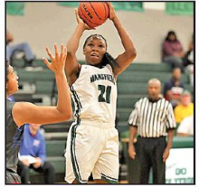 Lady Wolverine Senior, Taylor DeWitt, putting up a jumper by Mickey Morgan