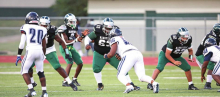 Wolverines Fall to Raiders in Tough Friday Night Battle