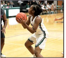 Pe’yton Peoples, junior, preparing to shoot by Mickey Morgan