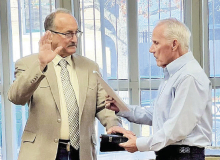 Haus Cordray (on left) is sworn in by former DeSoto Parish Tax Assessor Jimmy Stephens, who originally hired Cordray to the Assessor Office.