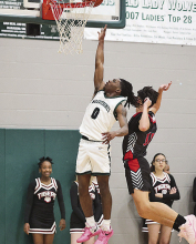 Both Mansfield High Lady Wolverines and Wolverines Defeat Many