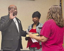 Manseld Mayor Thomas Jones is sworn into office by DeSoto Clerk of Court Lisa Lobrano Burson with Mrs. Jones as witness.