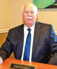 Community Bank Announces Retirement of John G. Russell