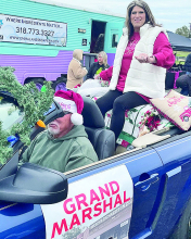 Grand Marshall Marva Anderson leads parade
