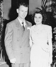 Beautiful young couple Raymond and Evelyn Powell at their wedding.