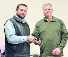 Sheriff Jayson Richardson (on left) presents Chief Deputy Raymond Sharrow his service revolver upon his retirement after 30 years of service.