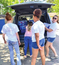 Logansport Jr. High Cheer & Pep Squad Disburse Water for Community Project