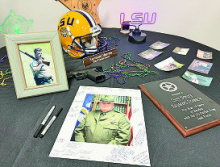 A table that displayed Chief Raymond Sharrow’s memories that decorated his office.