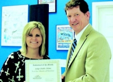 DeSoto Parish Chamber of Commerce President, Laurie Williamson, is shown presenting Judge Charles Adams a certificate honoring him as Individual Chamber Member for the Month of October.
